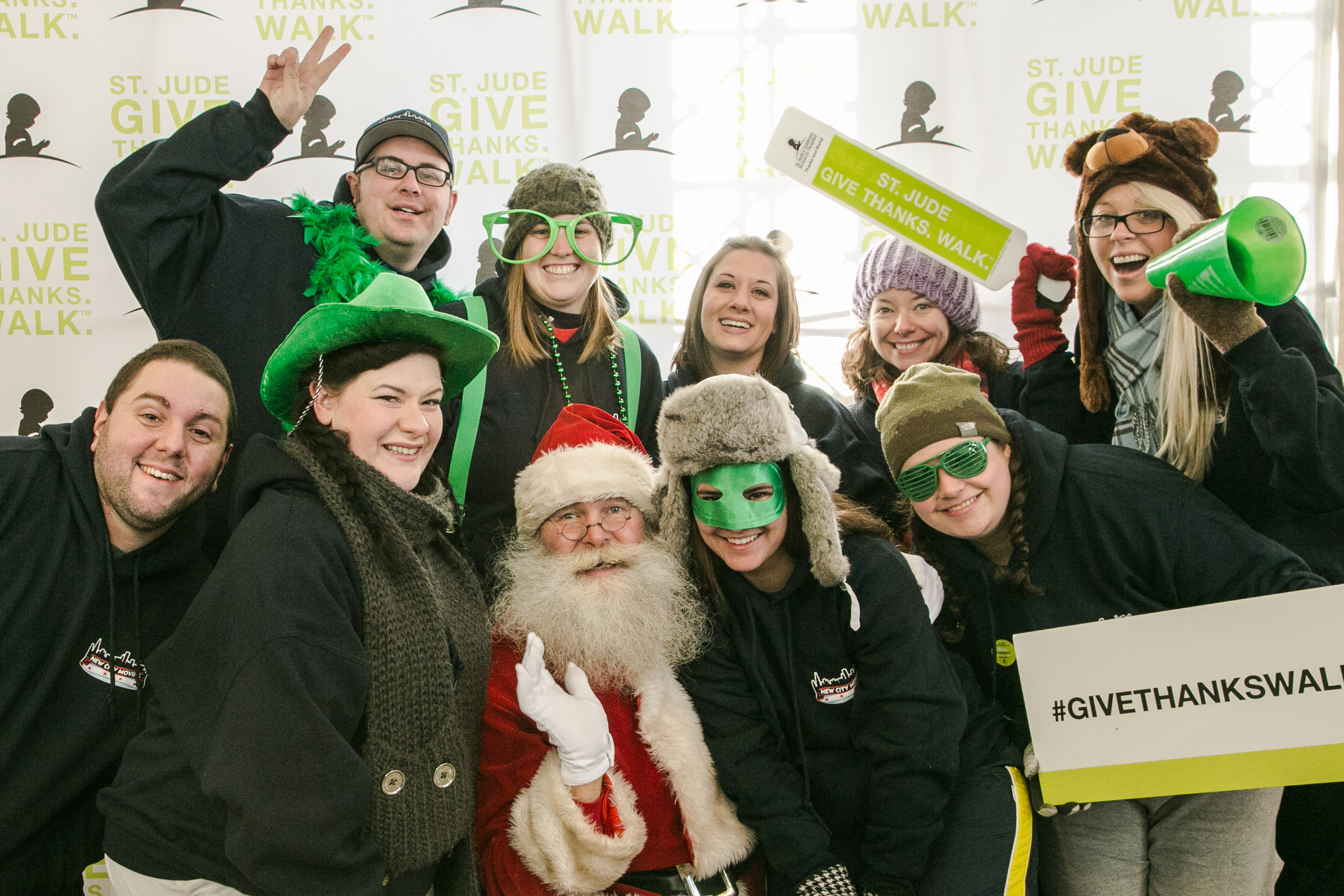 New City Moving employees pose with Santa Clause at St Jude event